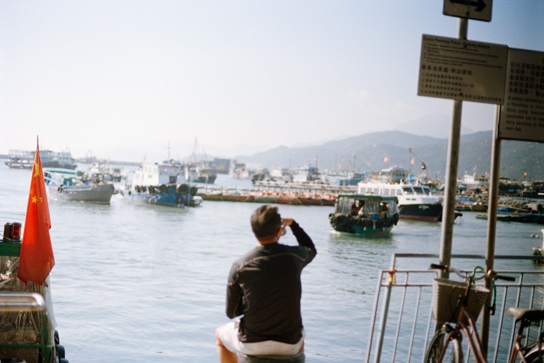 elderly fisherman by harbor
